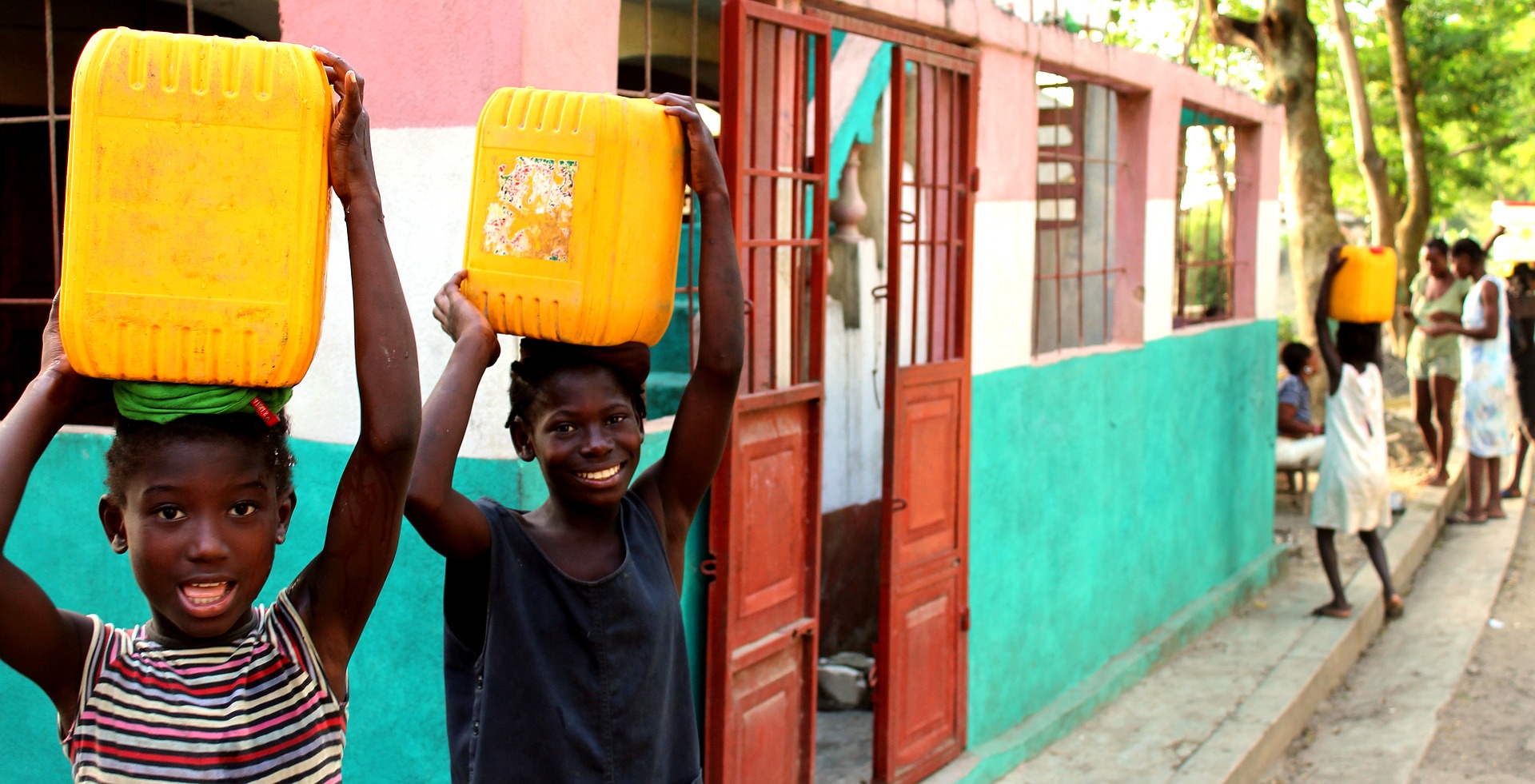 people of haiti carrying water