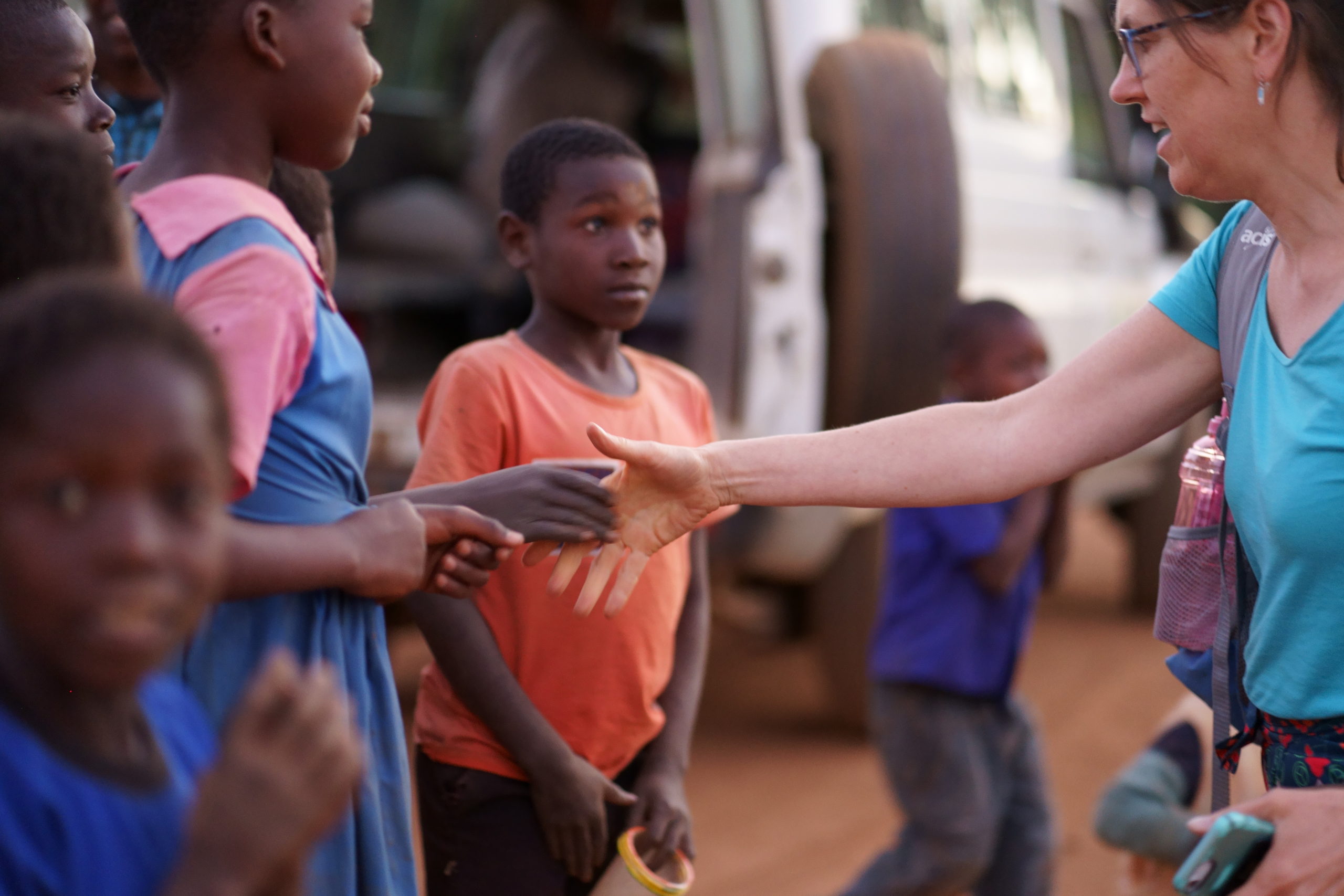 Dr. Barbara Edwards, Princeton internist, greeting the Malawi children